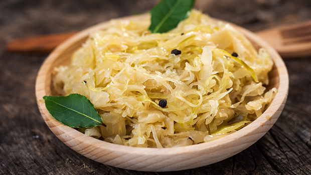 Braised cabbage with a garnish in a wooden bowl