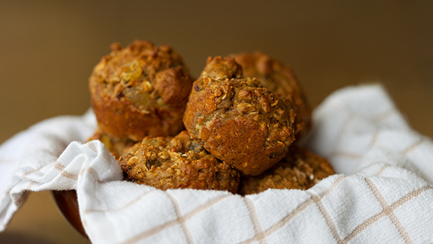 Bowl with white kitchen napkin filled with bran muffins